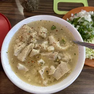 a bowl of soup and a plate of salad