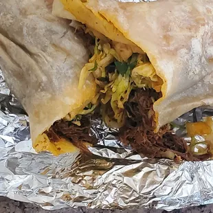 a burrito wrapped in foil