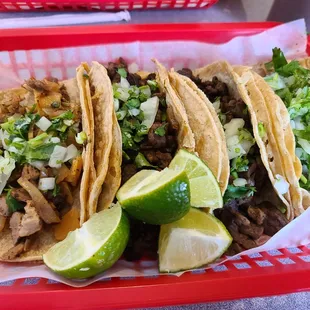 three tacoss in a basket