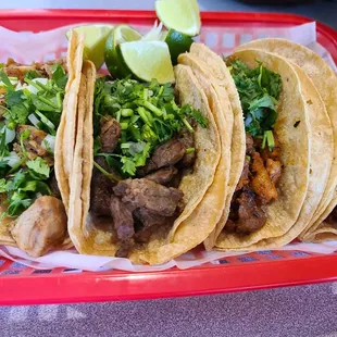 three tacoss in a basket