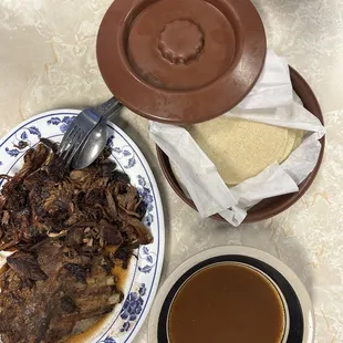 a plate of food and a cup of coffee