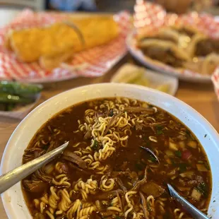 a bowl of soup with a spoon