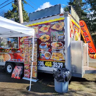 a food truck parked on the side of the road