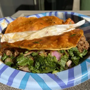 Quesatacos ($4 each) - Cheese tortilla, shredded beef, cilantro, onions. The cheese tortilla + dipped in Consomé brings it over the top.