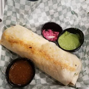 Burrito with verde sauce, chipotle sauce, and fresh red onions that seemed pickled--delicious!