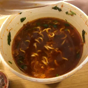 a bowl of soup with noodles