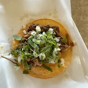 Birria taco; come plain and they bring you all condiments to table.