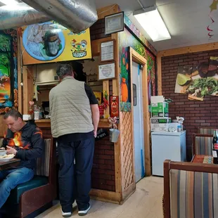 two men eating at a restaurant