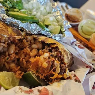 a burrito wrapped in tin foil