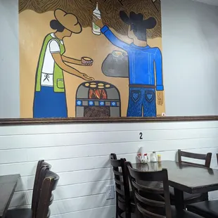 a painting of a man and woman preparing food