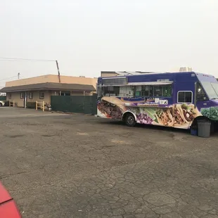 The truck parked in a big parking lot