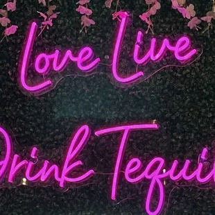 a neon sign that says love live drink tequila