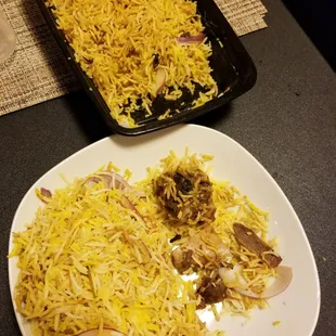 Goat Dum Biryani.. ooppss sorry.. 2 pieces of Goat Bones with a pool of yellow rice.