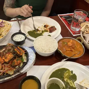Veg Dum Biryani (upper left), Paneer Tikka Kabob (lower left), Paneer Tikka Masala (center), Garlic Naan (right)