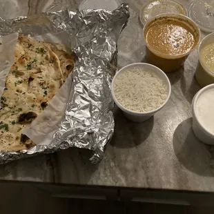 Butter Chicken, Garlic Naan, and vegetable korma