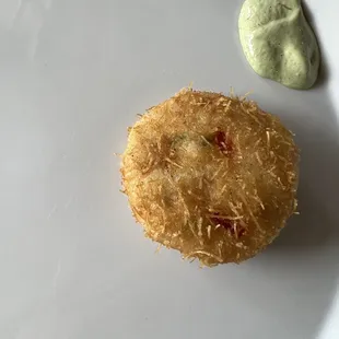 a plate of food with a green sauce