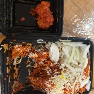 two trays of food on a table