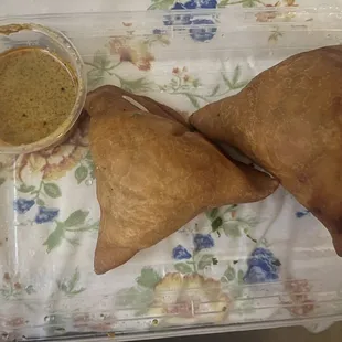 Samosas $4.99.  Sauce was good just not enough of it, outside is very good and crunchy yet soft but inside lacking flavor.
