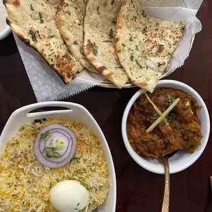 Biryani, garlic naan, and Jalfrezi Curry