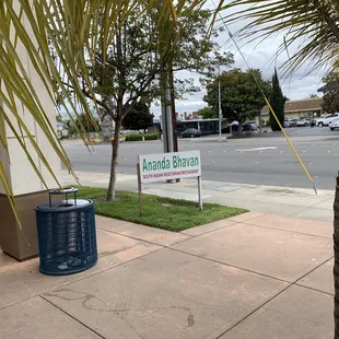 trash can on the sidewalk