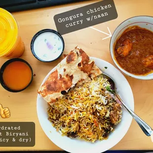 Hydrated Goat Biryani and Gongura chicken curry with Naan. Yogurt Mango smoothie.