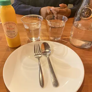 a man sitting at a table with a plate of food