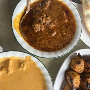 Butter chicken, spicy paneer, garlic naan bread, kabobs