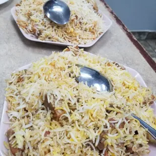 Mutton dum biryani (front), chicken dum biryani (rear)