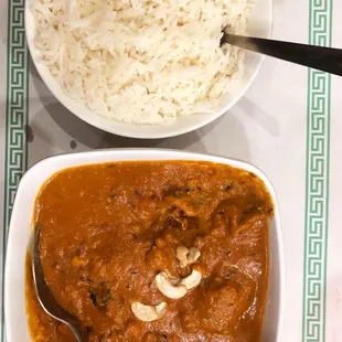 a bowl of curry and a bowl of rice
