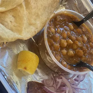 a bowl of beans and tortillas