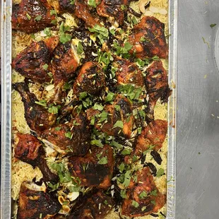 a pan of chicken and rice