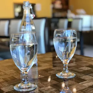 Water glasses and water bottle provided to tables.