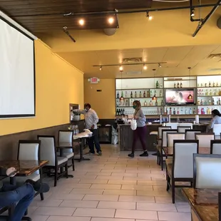 Wide space leading up to the bar and the counter where take out orders can be picked up.