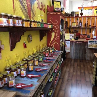 a display of jars of hot and spicy sauce