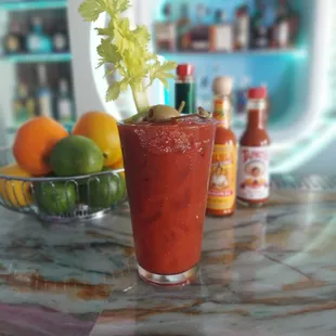 a bloody drink with a garnish of celery