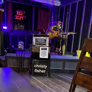 a man playing a guitar