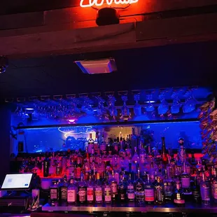 a bar with a neon sign
