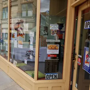 a storefront with a sign in the window