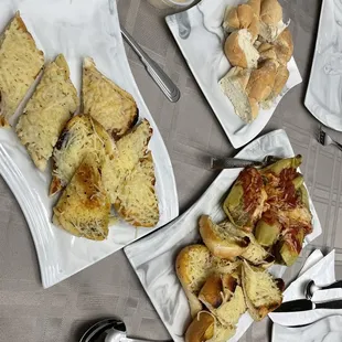Cheesy goodness garlic bread and spicy sausage stuffed peppers