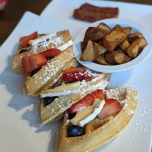 Waffles with brie &amp; fruit compote, breakfast potatoes and andouille sausage.