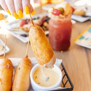 a person dipping a snack