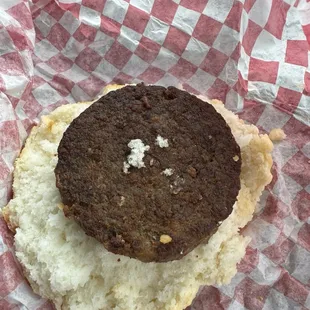 Sausage biscuit to show size of patty versus the size of the bread.