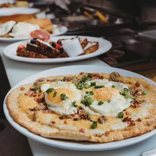 a pizza with eggs on it