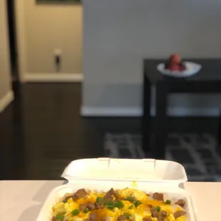 Donna Summer-3 biscuits split, gravy, 3 scrambled eggs, sausage, colby jack cheese, pepper &amp; chives