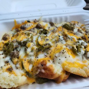 Biscuits and graveyard with sausage, cheese, and jalopenos