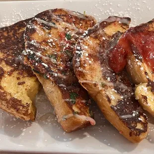 French toast flight: &quot;&quot;OG&quot; French Toast, Rum Boogie French Toast w/ rum Sauce, Strawberry French Toast, Fruity Crisp French Toast