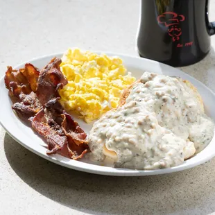 bacon, eggs, and gravy on a plate