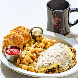 a plate of breakfast food and a cup of coffee