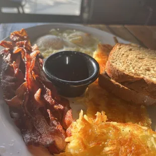 Crispy hash browns and crispy bacon.