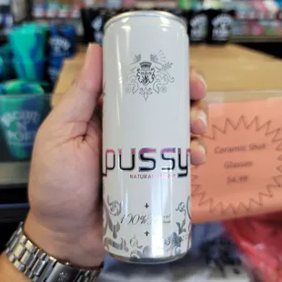  hand holding a can of dusty